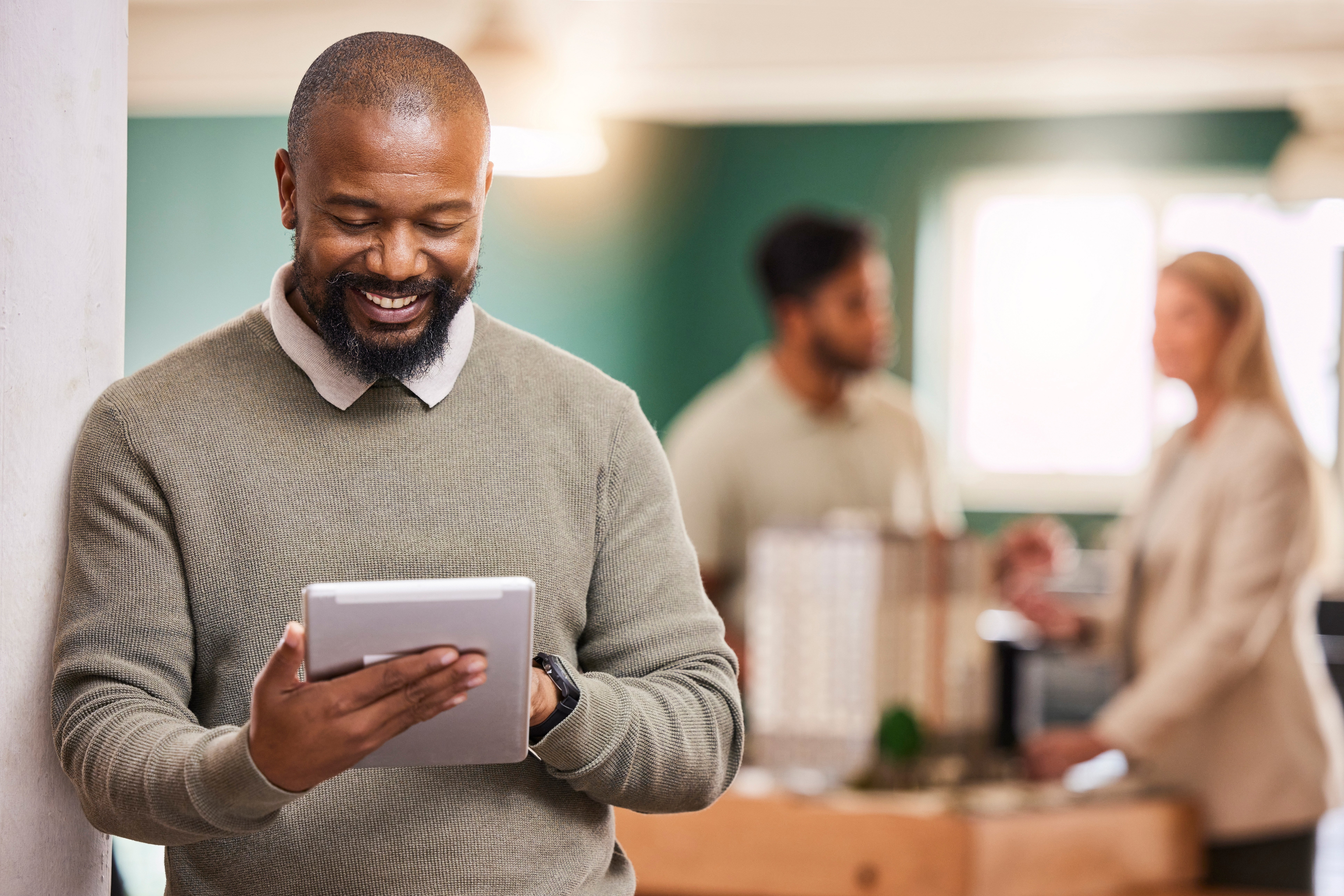 black-man-scroll-tablet-and-smile-at-startup-dig-2023-11-27-05-12-08-utc